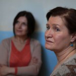 Close portrait of a woman, second woman in background